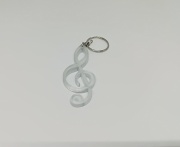 Přívěsek na klíče ve tvaru houslový klíč - průhledný