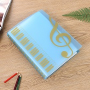Modrá složka na noty - houslový a basový klíč ve zlaté barvě