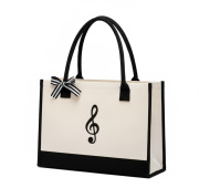 Velká černo-bílá taška s motivem houslového klíče